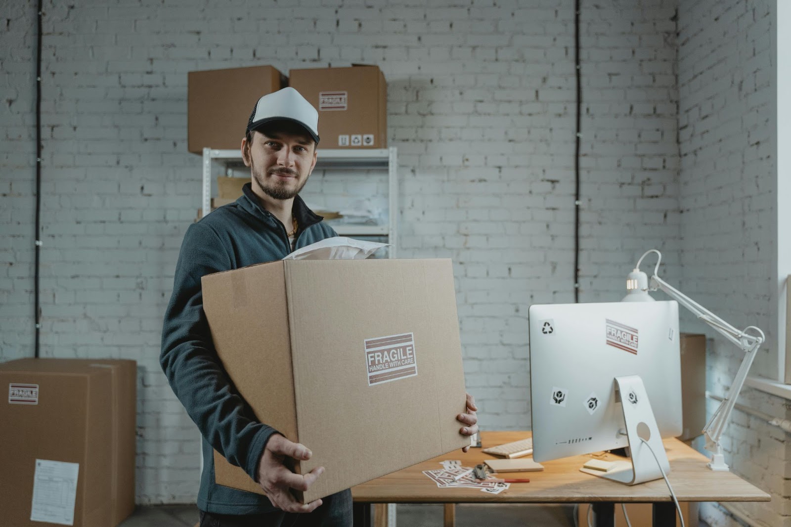 A warehouse employee prepares a box for shipment – Slotted